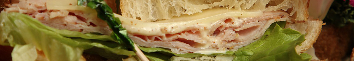 Eating Sandwich at Trio Cold Cuts & Sandwich Pub restaurant in Woodlyn, PA.